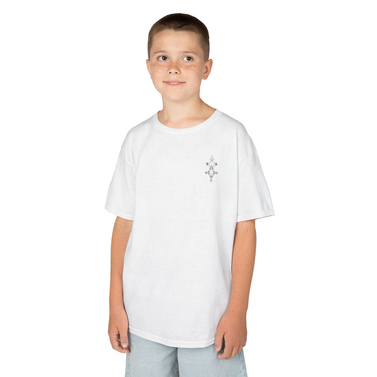 Boy wearing white Heavy Cotton™ Tee with small graphic on chest and light blue shorts