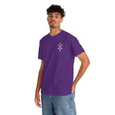 Man wearing a purple heavy cotton tee with a small geometric design on chest and blue jeans