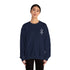 Woman wearing navy blue Heavy Blend™ crewneck sweatshirt with small embroidered design on chest