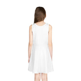 Back view of a girl wearing a white sleeveless A-line sundress for summer