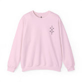 Women Heavy Blend™ Crewneck Sweatshirt in light pink with soft cotton-polyester blend and ribbed collar, featuring small chest embroidery.