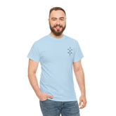man wearing light blue heavy cotton tee with small design on chest and jeans smiling