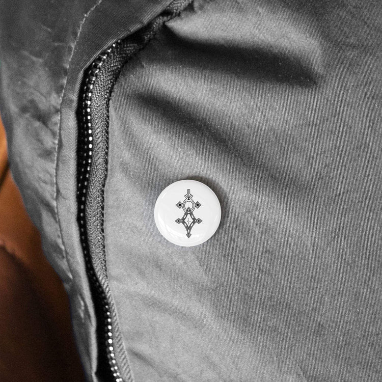 Round Pins with steel inner shell, magnetic backing, and scratch-resistant UV cover on fabric jacket