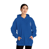 Woman wearing blue Heavy Blend™ Hooded Sweatshirt with kangaroo pocket and small chest embroidery