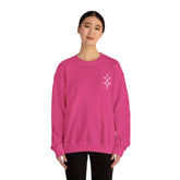 Women wearing pink Heavy Blend™ Crewneck Sweatshirt with embroidered design on chest