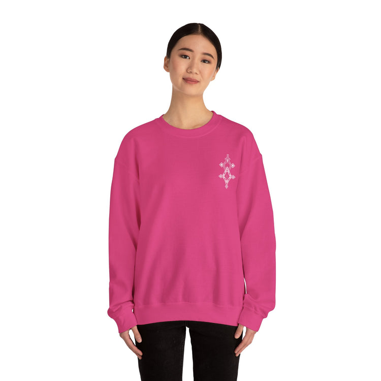 Women wearing pink Heavy Blend™ Crewneck Sweatshirt with embroidered design on chest