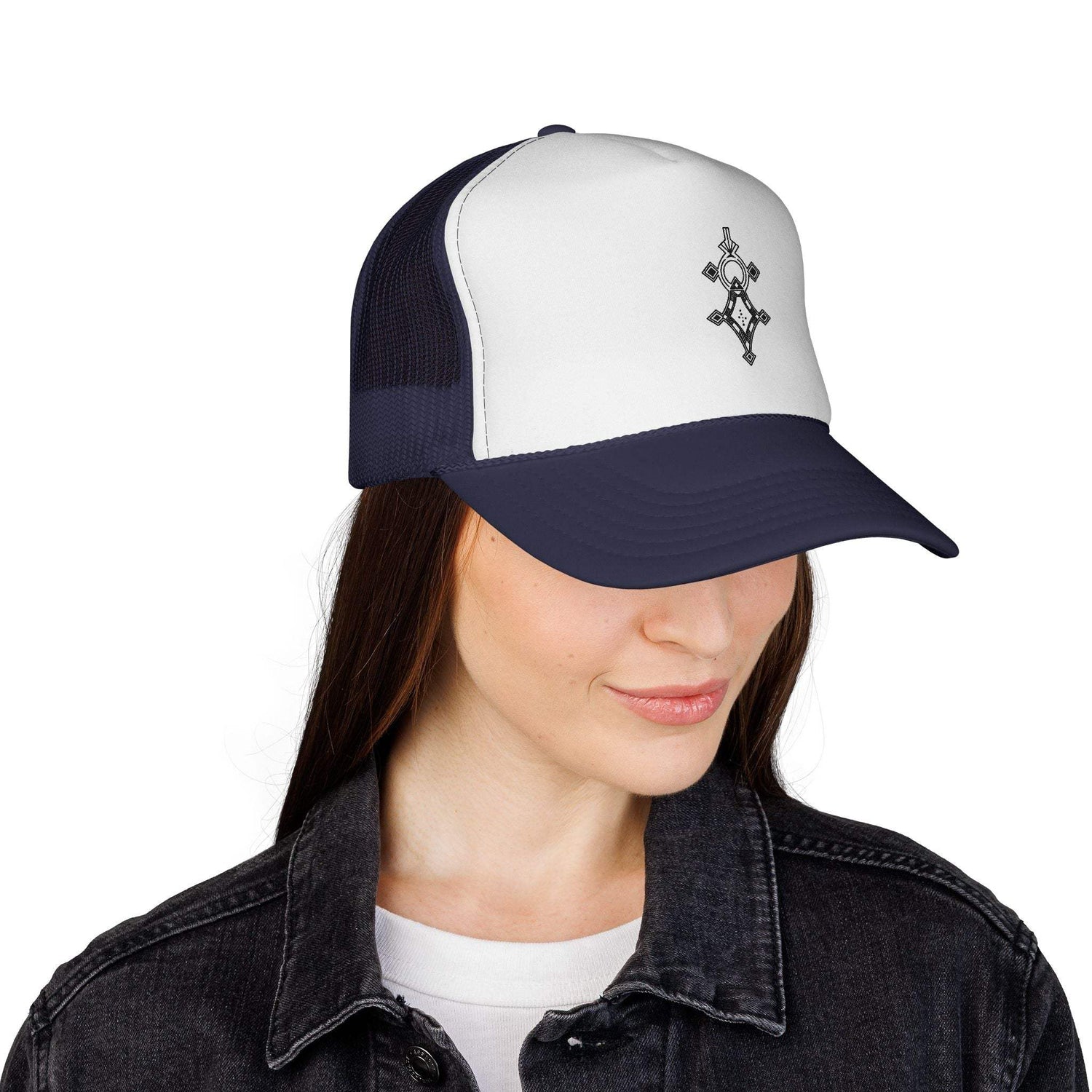 Woman wearing navy and white trucker cap with adjustable snapback and embroidered logo