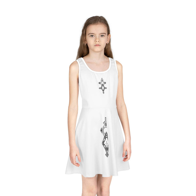 Girl wearing a white sleeveless sundress with black geometric designs, mid-length A-line cut, round neckline
