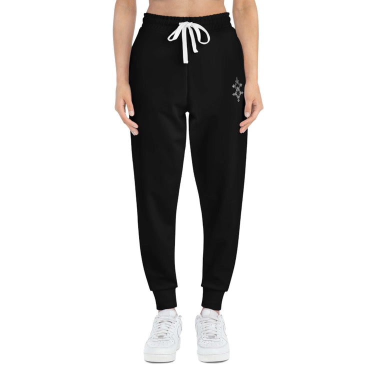 Black women athletic joggers with white drawstring and cuffed ankles, styled for workouts and lounging