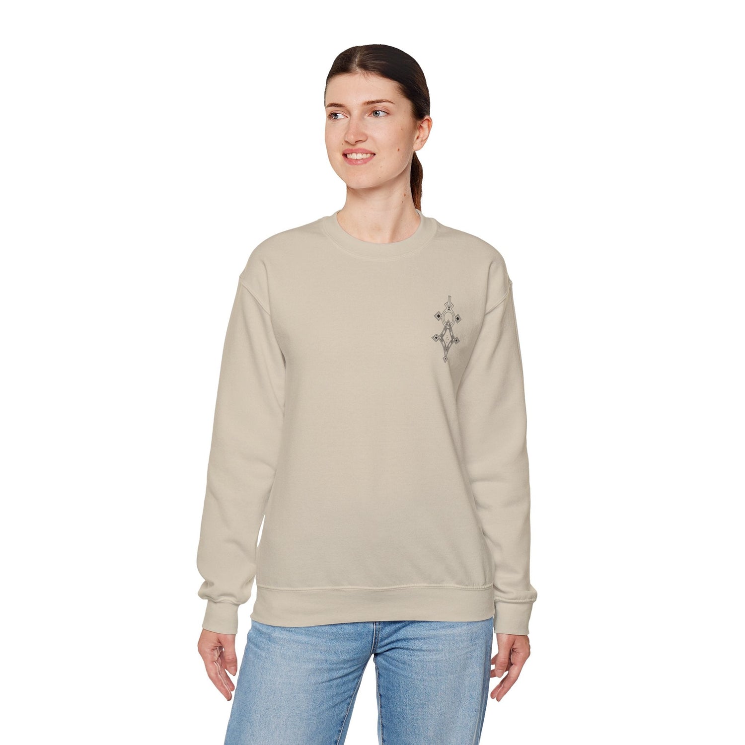 Women Heavy Blend™ Crewneck Sweatshirt in beige, medium-heavy cotton-polyester blend, classic fit with ribbed collar and durability stitching, modeled by woman in casual jeans