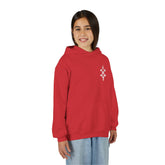 Girl wearing red heavy blend hooded sweatshirt with front kangaroo pocket and embroidery on chest