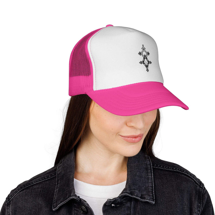 Woman wearing pink and white trucker cap with adjustable snapback and mesh back