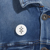 Round Pins with steel shell and glossy UV cover attached to denim jacket