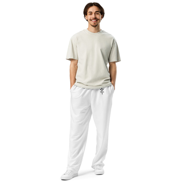 man wearing white wide-leg joggers with side pockets and elastic waistband with drawstring