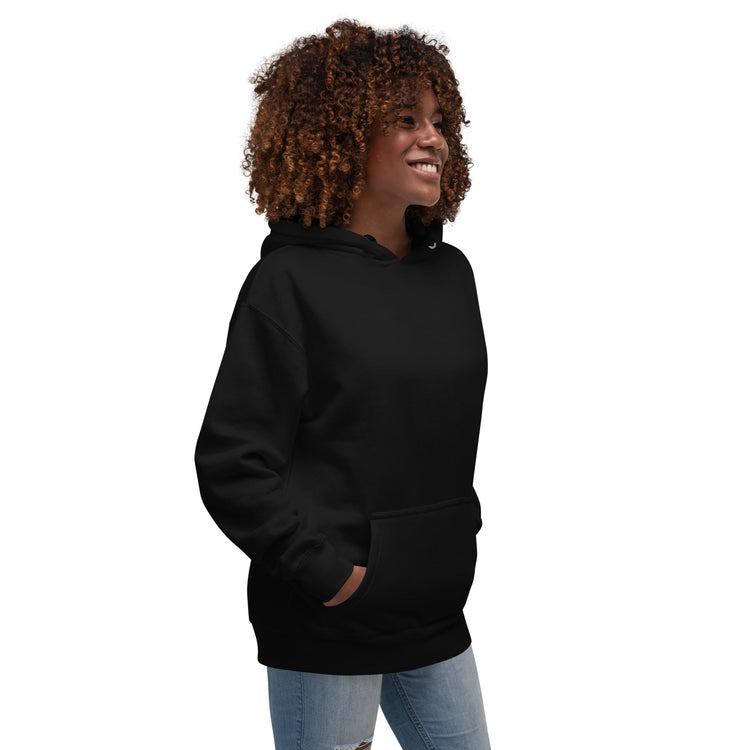 Woman wearing black cotton blend hoodie with pouch pocket and hood smiling standing sideways