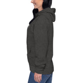 Side view of a woman wearing a dark gray soft cotton blend women hoodie with front pouch pocket and hood