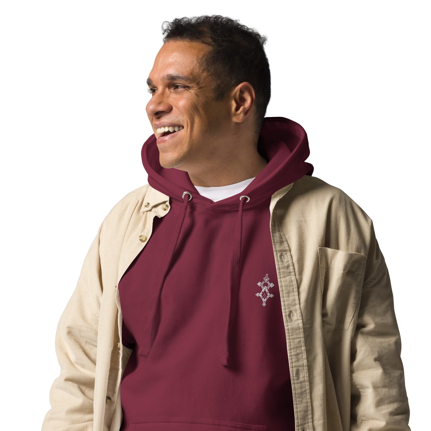Men hoodie in maroon with front pouch pocket and hood, worn with beige shirt, casual streetwear style