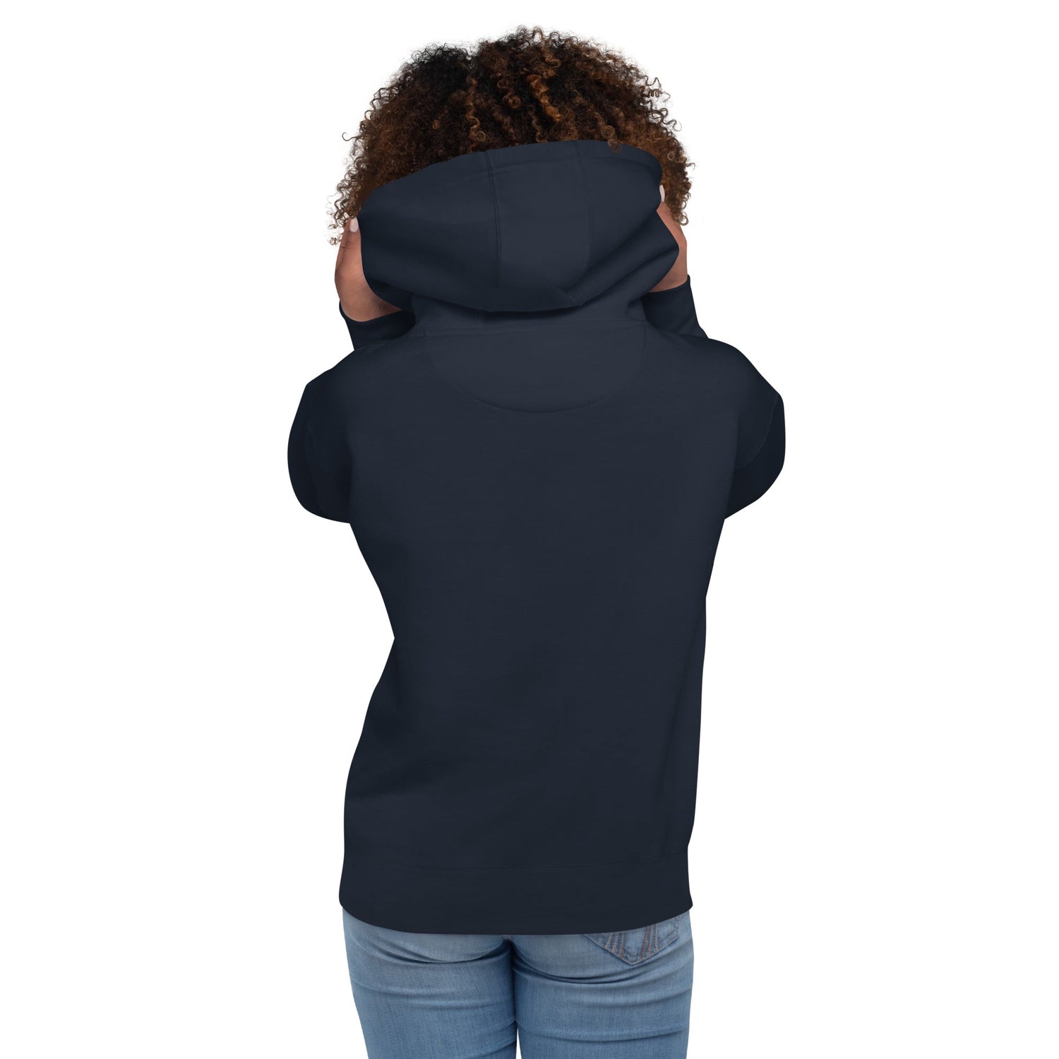 Back view of a woman wearing a black women hoodie with hood up and hands touching the hood