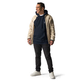 Men wearing navy blue men hoodie with pouch pocket and beige jacket standing isolated on white background