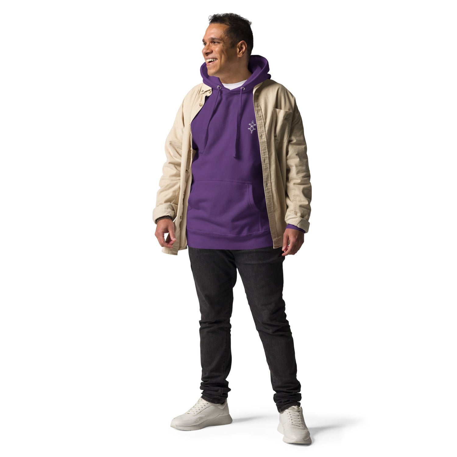 Men wearing purple cotton hoodie with pouch pocket and beige jacket, black pants, and white sneakers