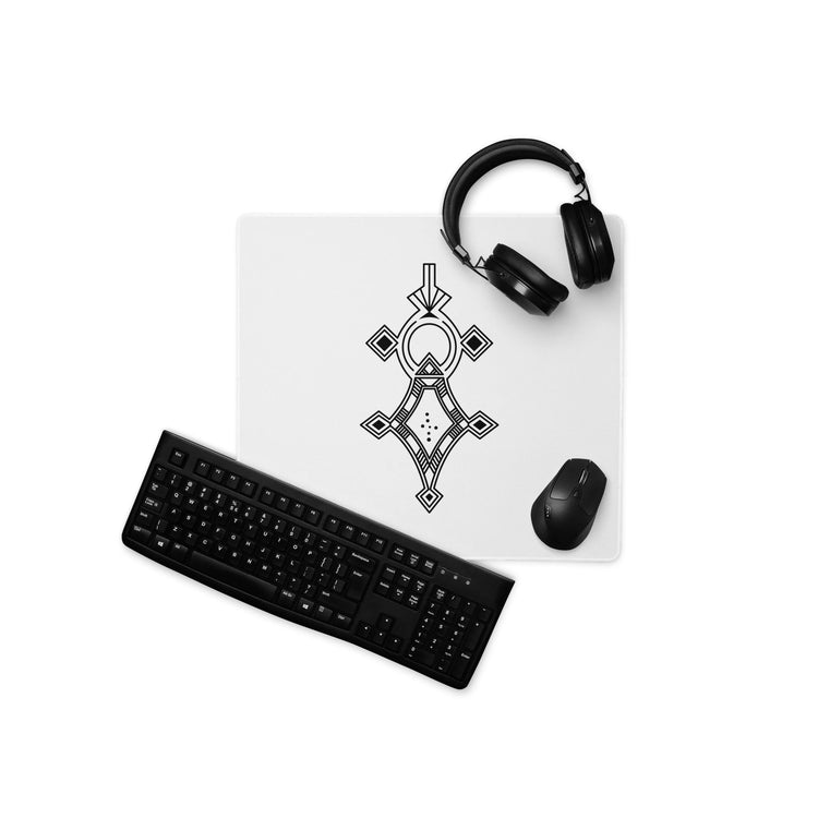Large white gaming mouse pad with black geometric design, paired with black keyboard, mouse, and headphones on white background