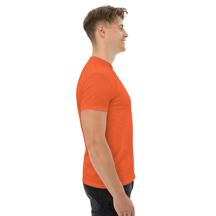 Side view of man wearing orange classic tee made of cotton blend fabric