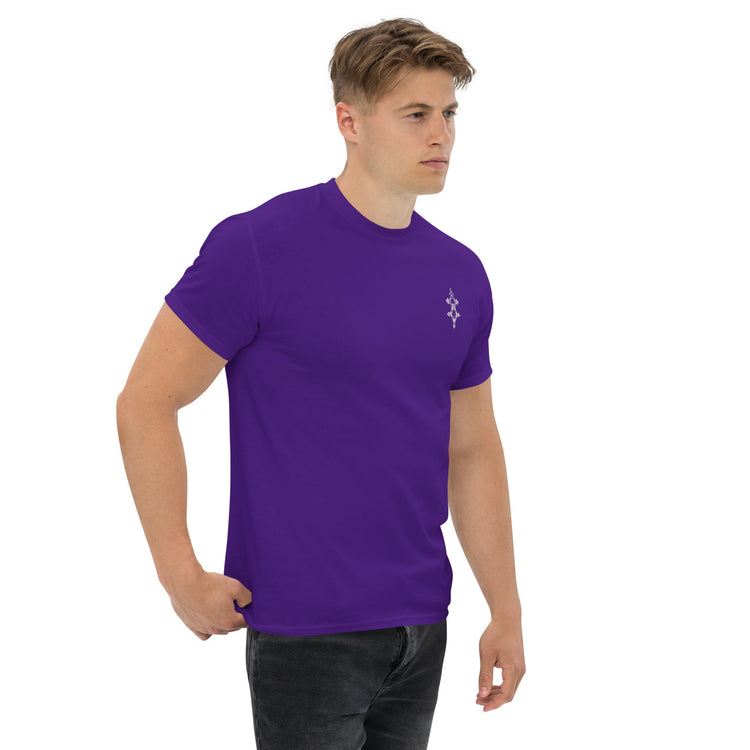 Man wearing purple classic tee with small chest design, paired with black jeans