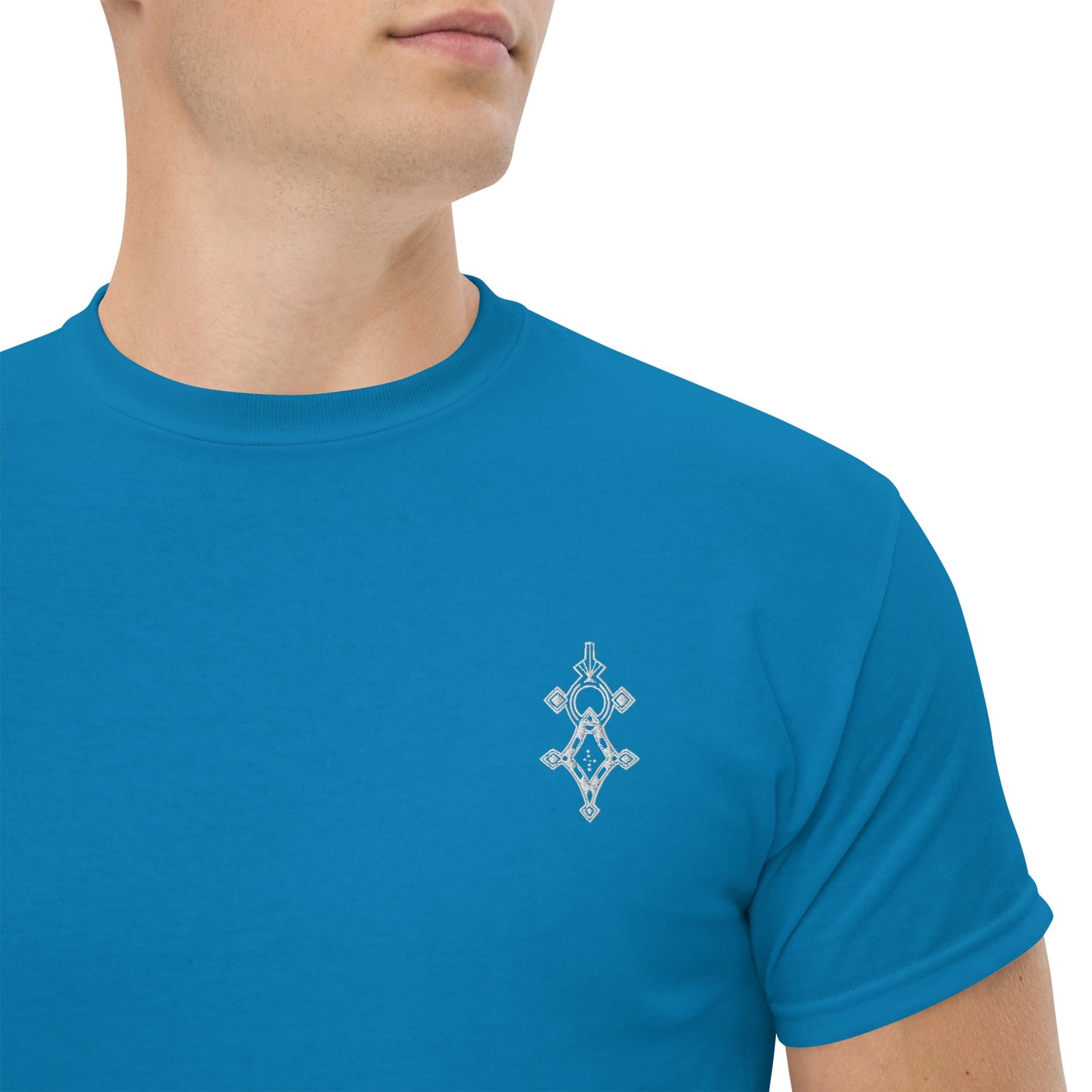 men wearing blue cotton classic tee with small geometric design on chest