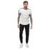 Men fleece sweatpants in black worn with white tee and sneakers