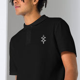 Man wearing black men polo shirt with embroidered logo on chest, classic collar, short sleeves, and semi-fitted cut