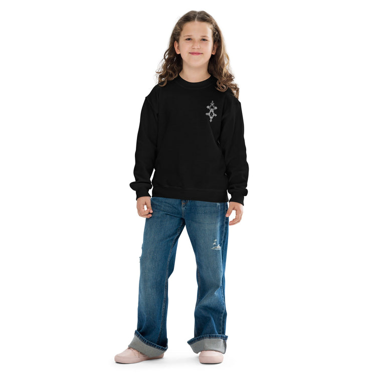 Youth crewneck sweatshirt in black worn by child, soft fleece fabric, casual and comfortable design