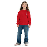 Youth wearing red cozy crewneck sweatshirt with jeans, comfortable and casual youth crewneck sweatshirt.