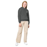 Youth heavy blend hoodie worn by child with durable fleece fabric and front pouch pocket