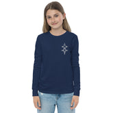 Youth long sleeve tee in navy blue with ribbed cuffs worn by a smiling girl