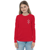 Youth long sleeve tee in red with ribbed cuffs and crew neck worn by girl