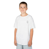 Boy wearing white Heavy Cotton™ Tee with small graphic on chest and light blue shorts