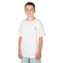Boy wearing white Heavy Cotton™ Tee with small graphic on chest and light blue shorts