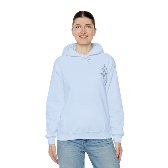 woman wearing light blue Women Heavy Blend™ Hooded Sweatshirt with kangaroo pocket and drawstring hood