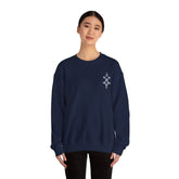Woman wearing navy blue Heavy Blend™ crewneck sweatshirt with small embroidered design on chest