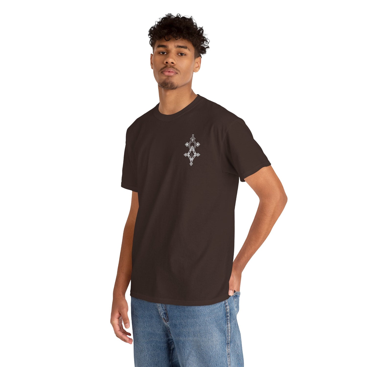 man wearing dark brown heavy cotton tee with small chest design and blue jeans against white background