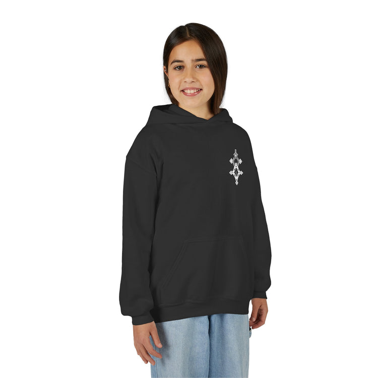 Girl wearing black Girls Heavy Blend Hooded Sweatshirt with front kangaroo pocket and embroidery on chest