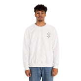 Men wearing white Heavy Blend™ Crewneck Sweatshirt with small chest embroidery and blue jeans on white background