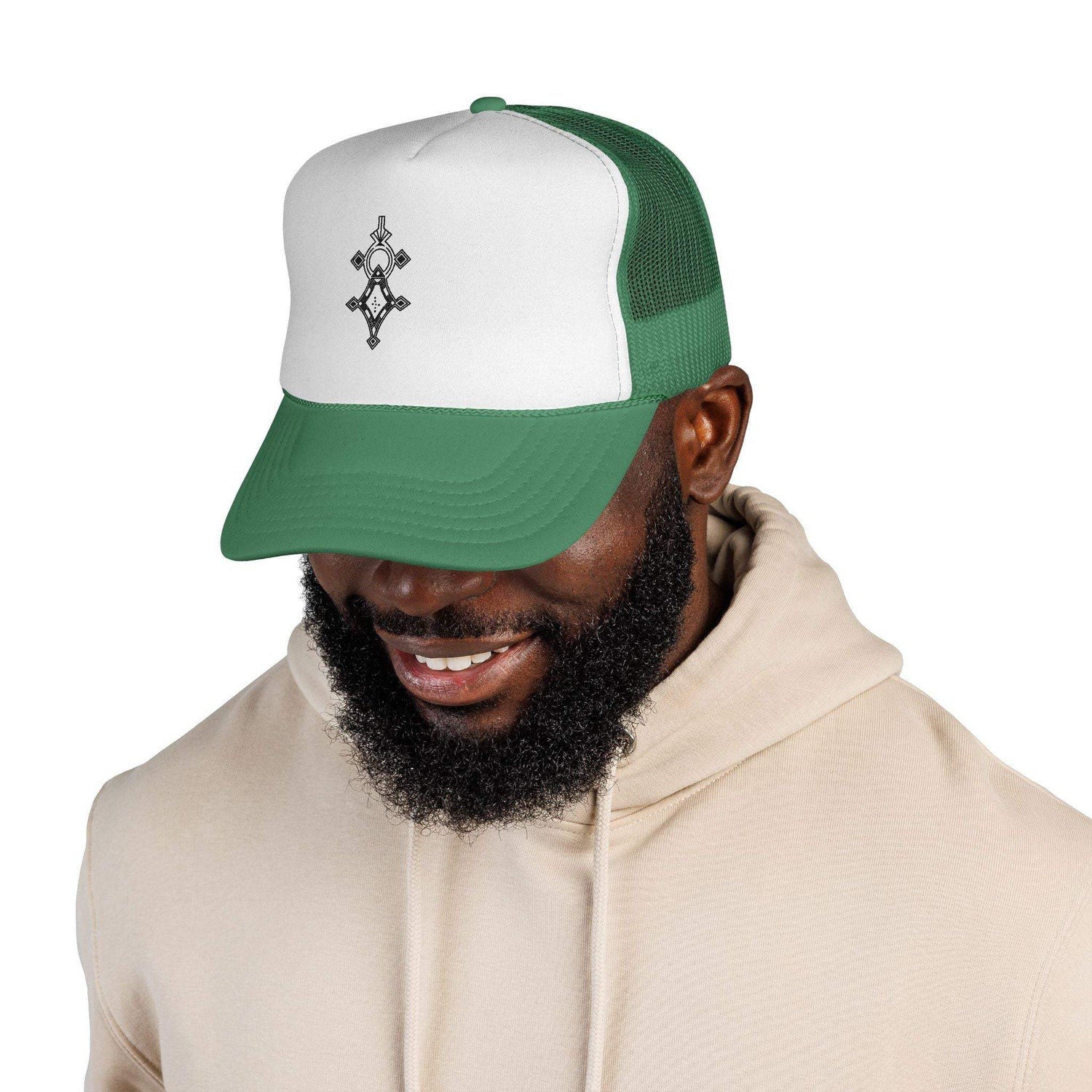 Man wearing green and white trucker cap with adjustable snapback and mesh back