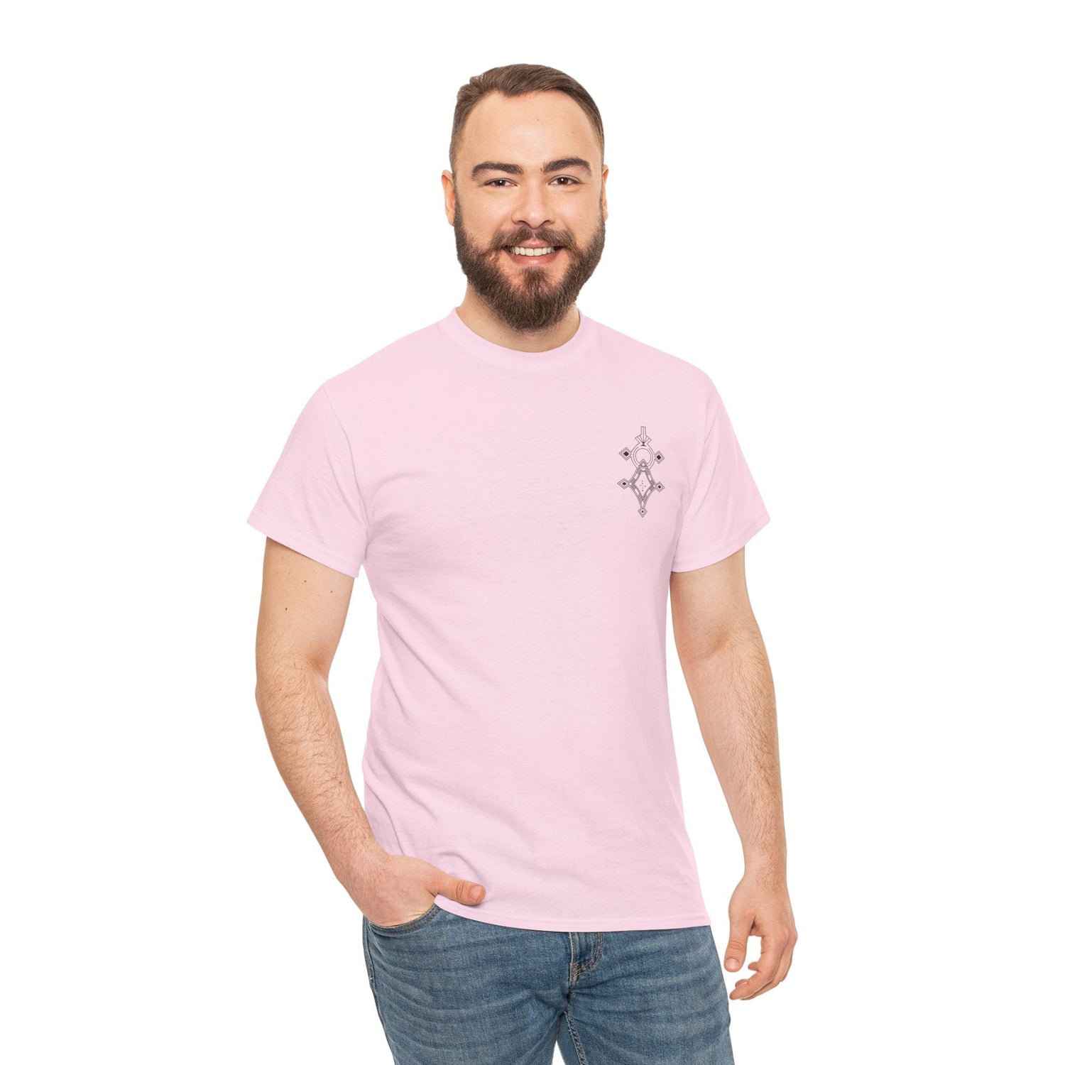 man wearing light pink heavy cotton tee with small geometric design on chest and blue jeans smiling