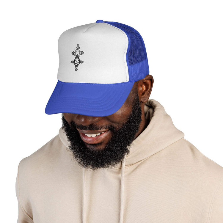 Blue and white trucker cap with adjustable snap closure and six-row visor stitching worn by smiling man