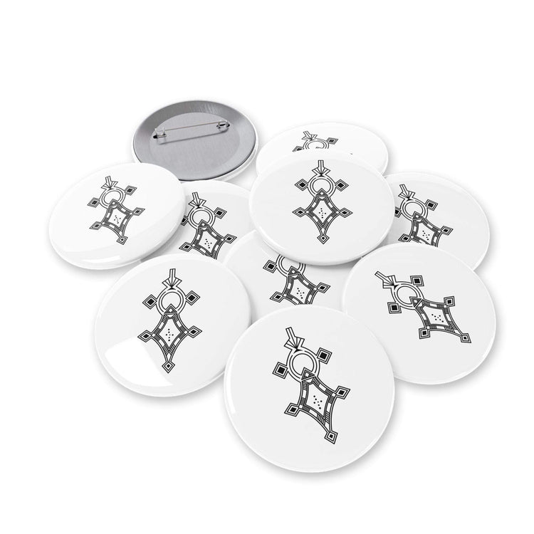 Set of round pins with white background and black geometric design, steel shell, magnetic metal backing, and scratch-resistant glossy finish.