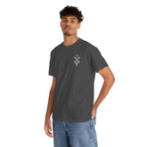 man wearing dark gray heavy cotton tee with small white design on chest and blue jeans