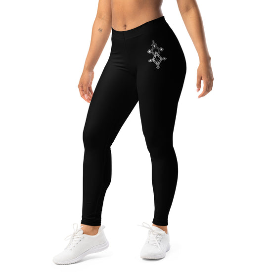 Black polyester spandex leggings with elastic waistband and white geometric design on thigh