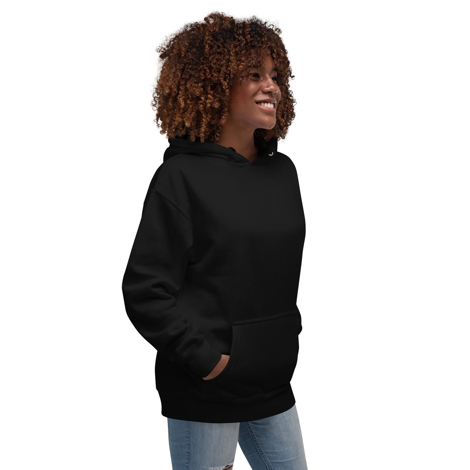 Woman wearing black cotton blend hoodie with pouch pocket and hood smiling standing sideways