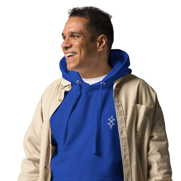 Smiling man wearing blue men hoodie with front pocket and beige open shirt